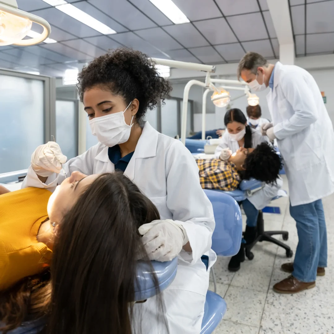 Students learning advanced clinical dentistry during a hands-on training program at GADE.
